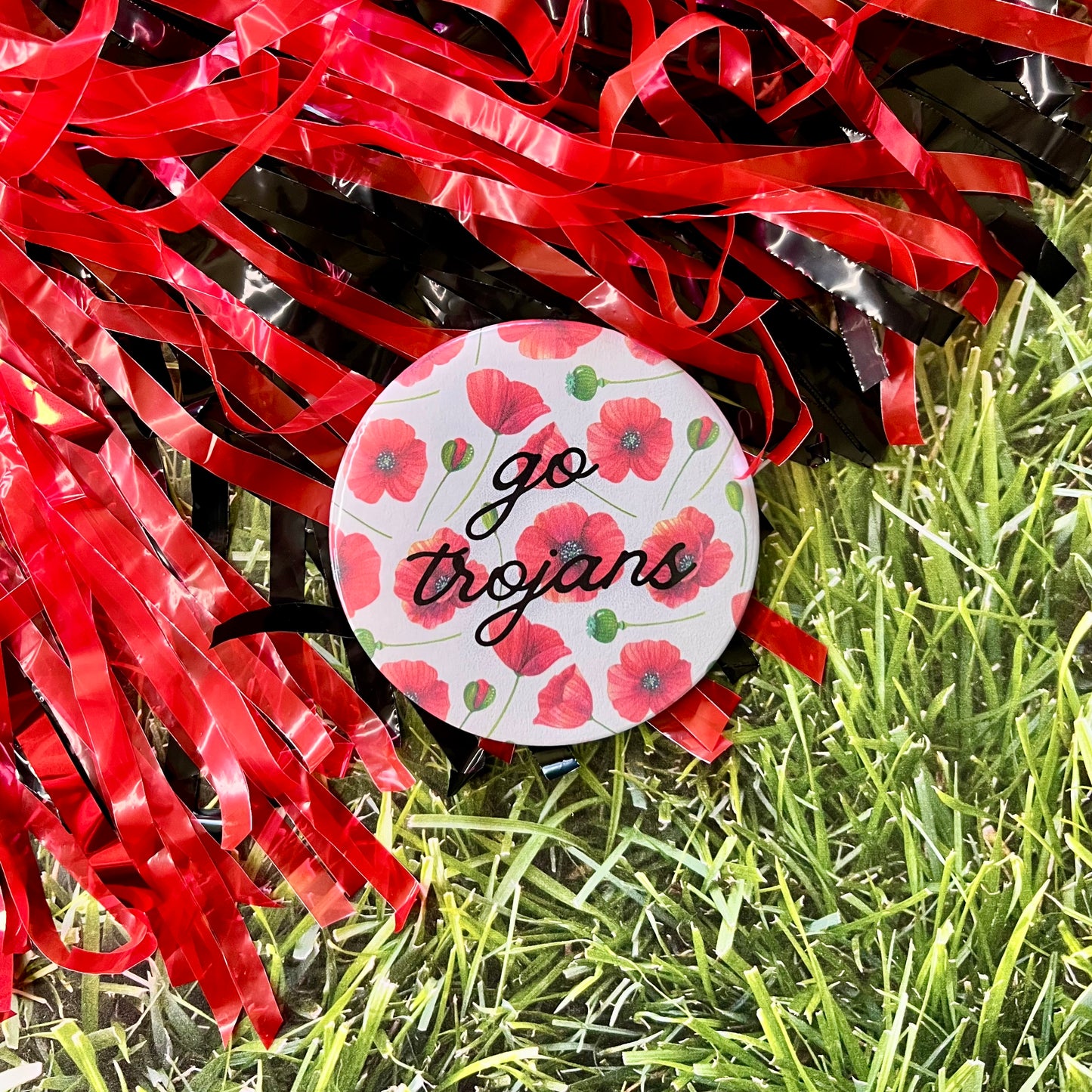 Floral Go Trojans Button