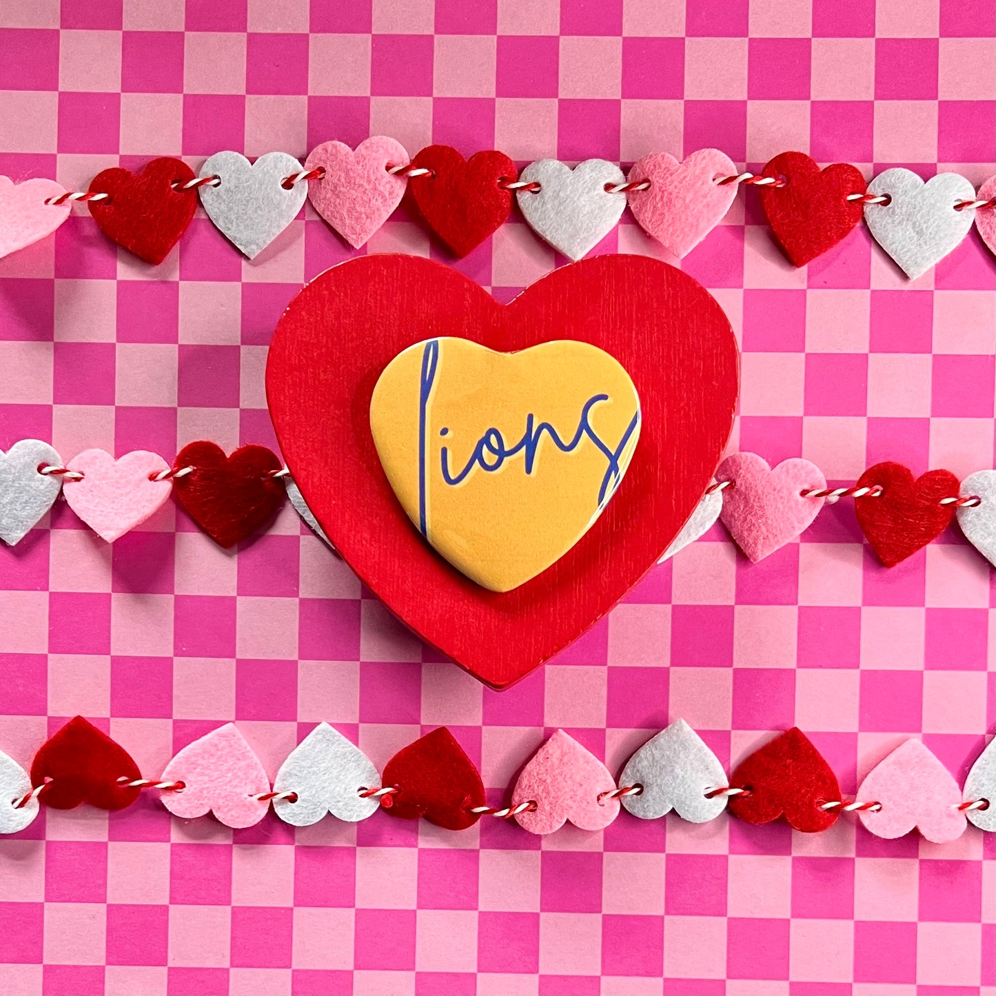 UNA Lions Script Heart Button